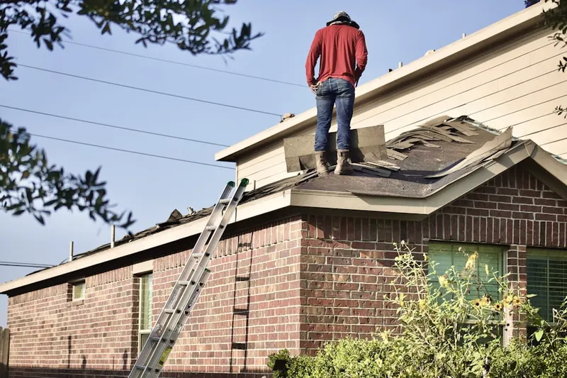 Professional roofer working on a residential roof in La Cumbre Estates